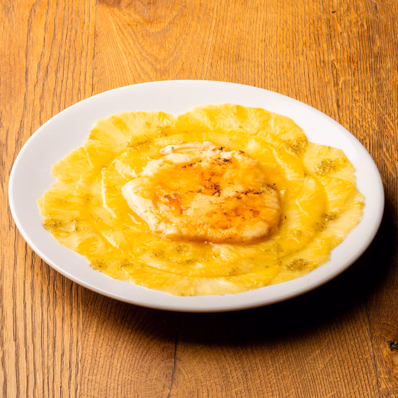 Pineapple carpaccio with catalan cream