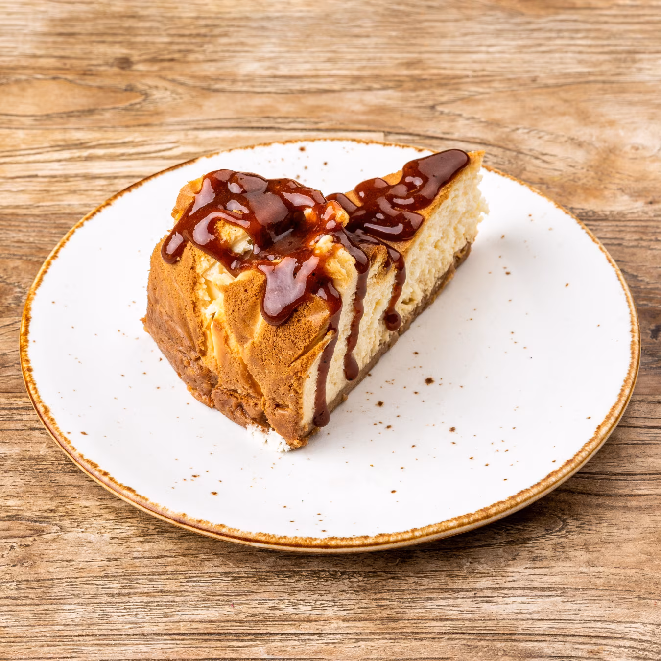 Homemade organic cheesecake with strawberry jam and Sichuan pepper